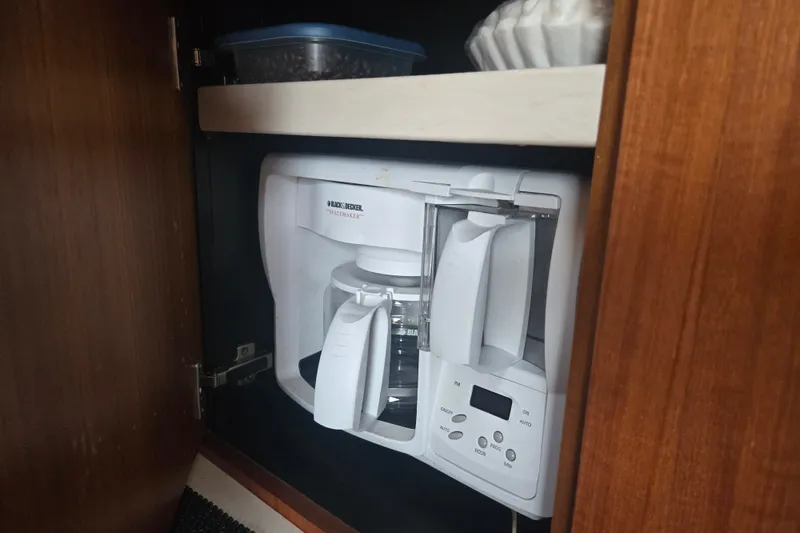 Slide: The Image of Coffee maker inside a wooden cabinet on a 2005 Tiara Yachts 3600 Open. - 28
