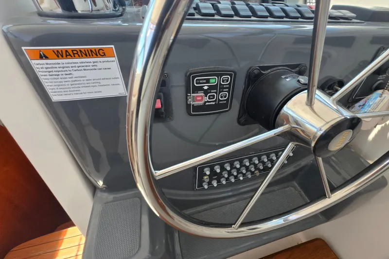 Slide: The Image of Steering wheel and control panel of 2005 Tiara Yachts 3600 Open boat. - 14