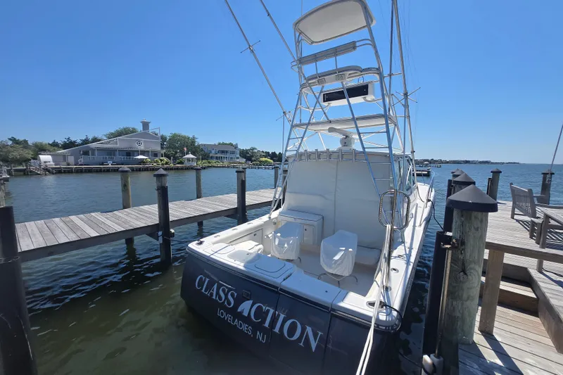 Slide: The Image of 2005 Tiara Yachts 3600 Open docked in Loveladies, NJ, under clear blue skies. - 24