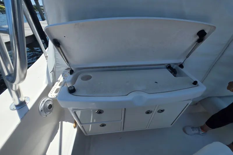 Slide: The Image of 2005 Tiara Yachts 3600 Open boat interior with open storage compartment and speaker. - 18
