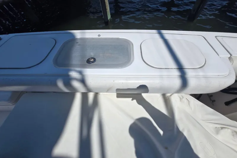 Slide: The Image of 2005 Tiara Yachts 3600 Open deck with storage compartments and water view. - 19