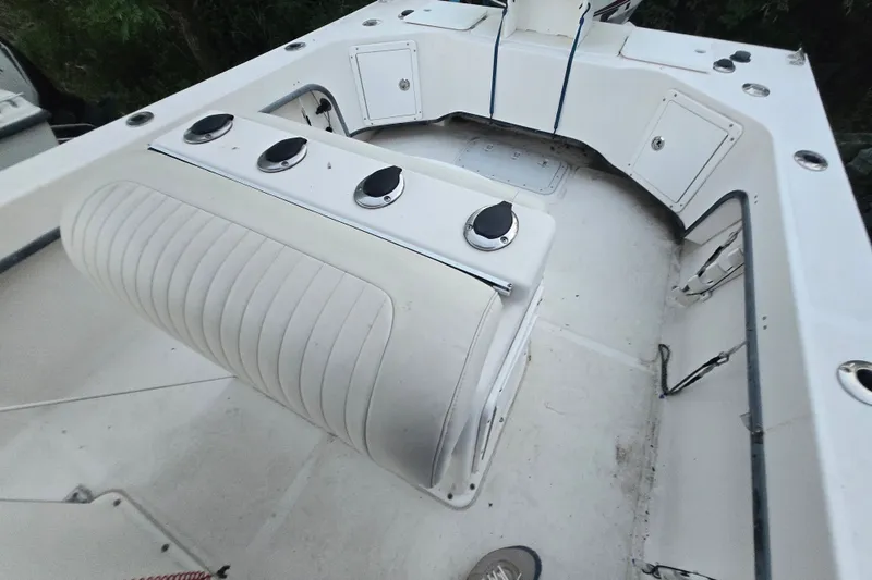 Slide: The Image of 2015 May-Craft 2300 CCX boat interior with seating and storage compartments. - 14