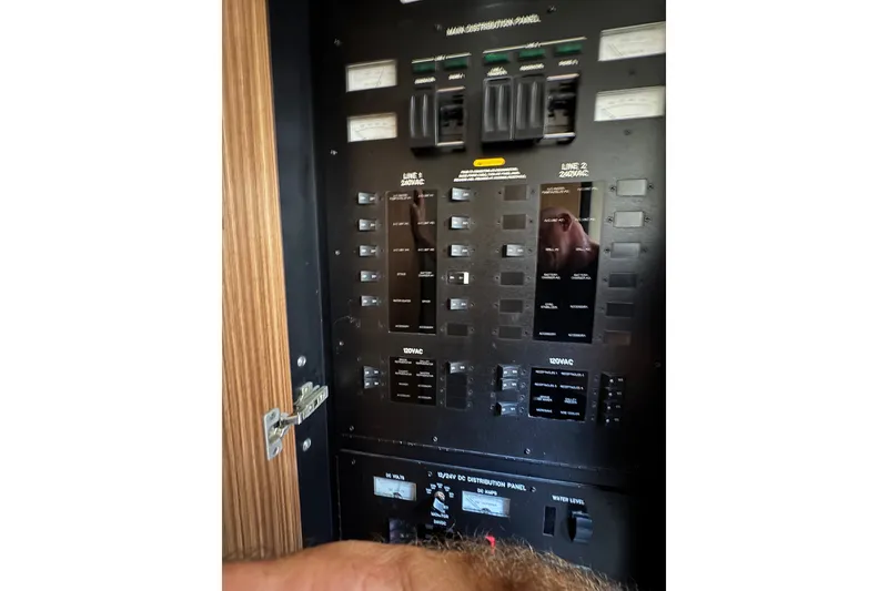 Slide: The Image of Electrical control panel on a 2016 Sea Ray L590 yacht. - 30