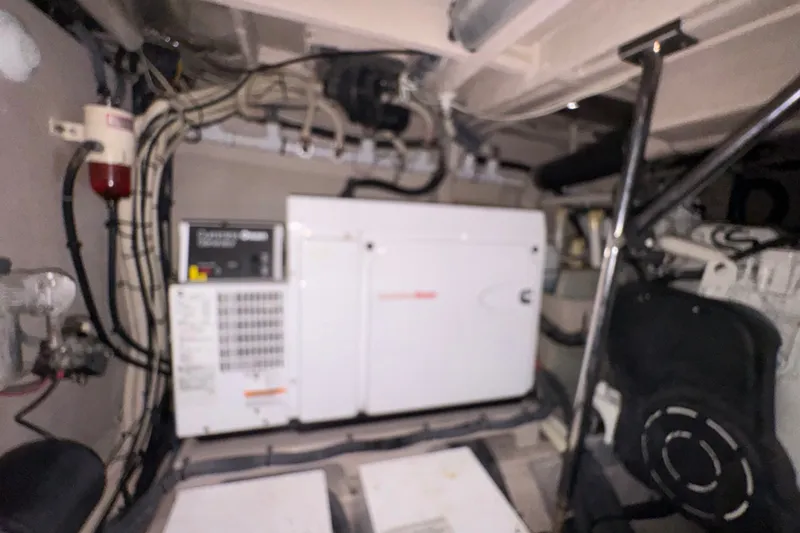 Slide: The Image of Engine room of 2016 Sea Ray L590 yacht with generator and wiring. - 33