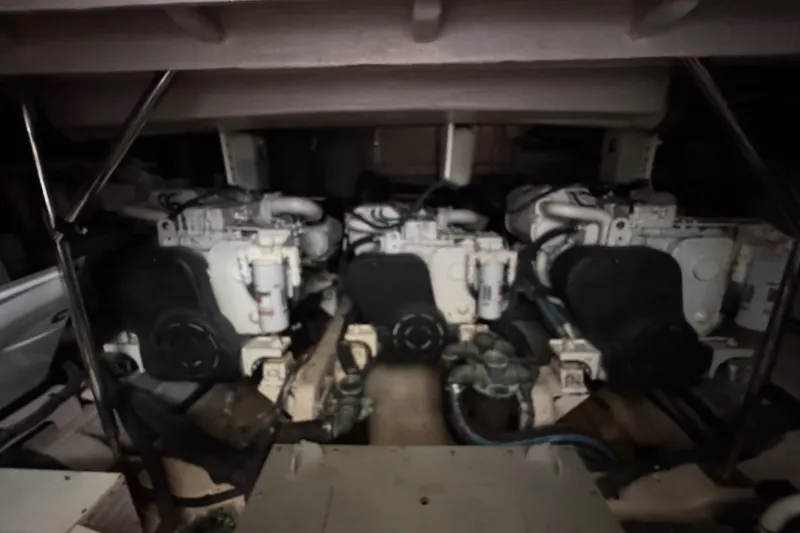 Slide: The Image of Engine room of 2016 Sea Ray L590 yacht, showcasing dual engines and mechanical components. - 32