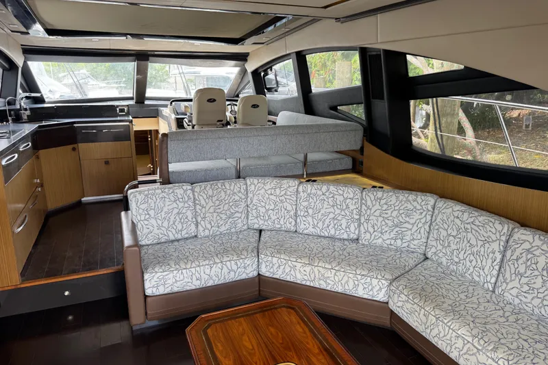 Slide: The Image of Luxurious interior of 2016 Sea Ray L590 yacht with elegant seating and modern kitchen. - 14