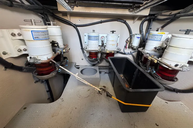 Slide: The Image of Engine room of 2016 Sea Ray L590 yacht with diesel filters and hoses. - 35