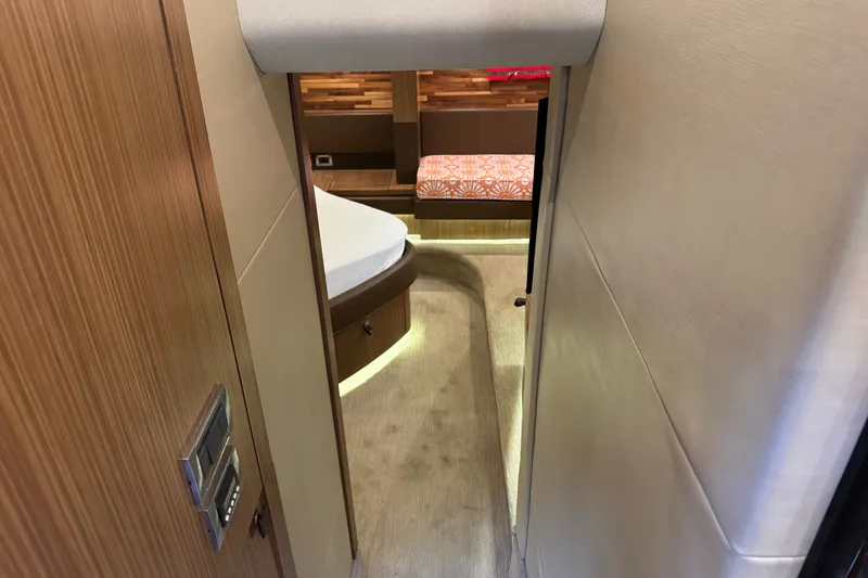 Slide: The Image of Interior view of 2016 Sea Ray L590 yacht cabin with modern wood finishes. - 21