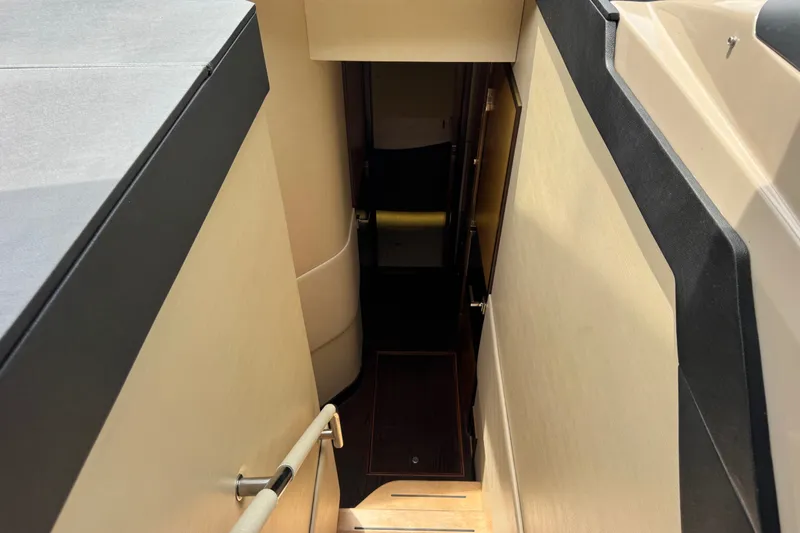Slide: The Image of Staircase leading to lower deck of 2016 Sea Ray L590 yacht interior. - 20