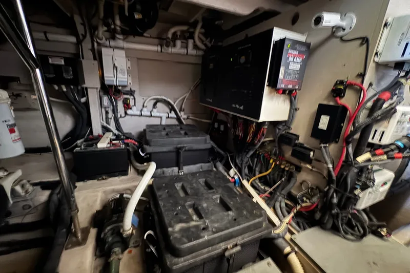 Slide: The Image of Engine room of a 2016 Sea Ray L590 yacht with electrical components and wiring. - 34