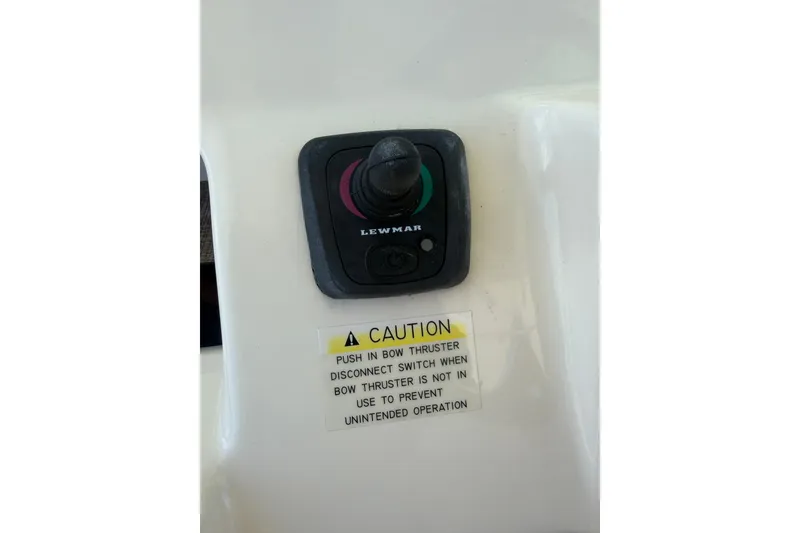 Slide: The Image of Lewmar bow thruster control on 2021 Grady-White Canyon 326 boat with caution label. - 82