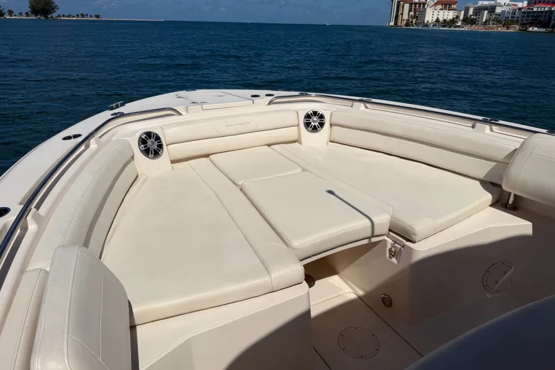 Slide: The Image of 2021 Grady-White Canyon 326 boat interior with cushioned seating, ocean view. - 79
