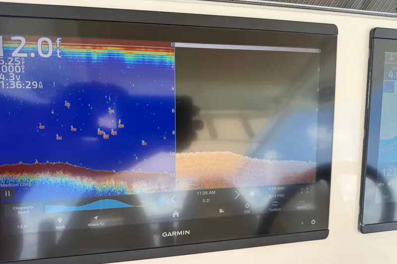 Slide: The Image of Garmin fishfinder display on 2021 Grady-White Canyon 326 boat, showing underwater sonar data. - 104