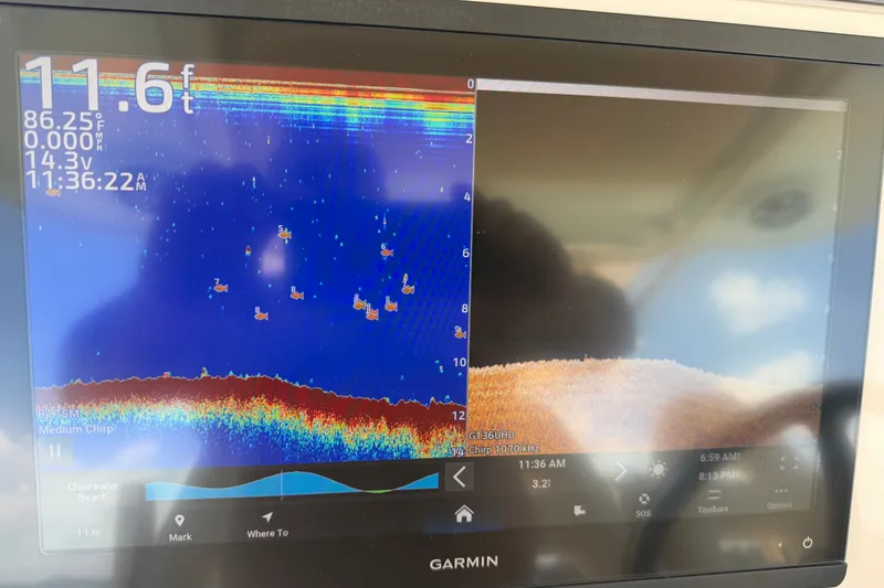 Slide: The Image of Garmin fishfinder display on 2021 Grady-White Canyon 326 boat, showing depth and fish locations. - 105
