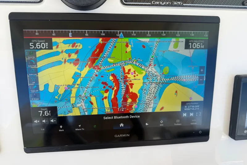 Slide: The Image of Garmin navigation display on 2021 Grady-White Canyon 326 boat, showing detailed marine map. - 54