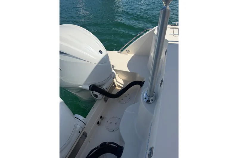 Slide: The Image of 2021 Grady-White Canyon 326 boat engine and deck view on water. - 93