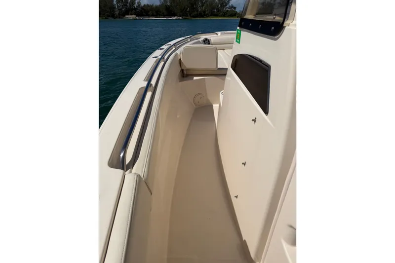 Slide: The Image of 2021 Grady-White Canyon 326 boat interior with sleek design and stainless steel railing. - 76