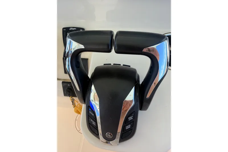 Slide: The Image of Throttle controls on a 2021 Grady-White Canyon 326 boat, featuring sleek design and functionality. - 81