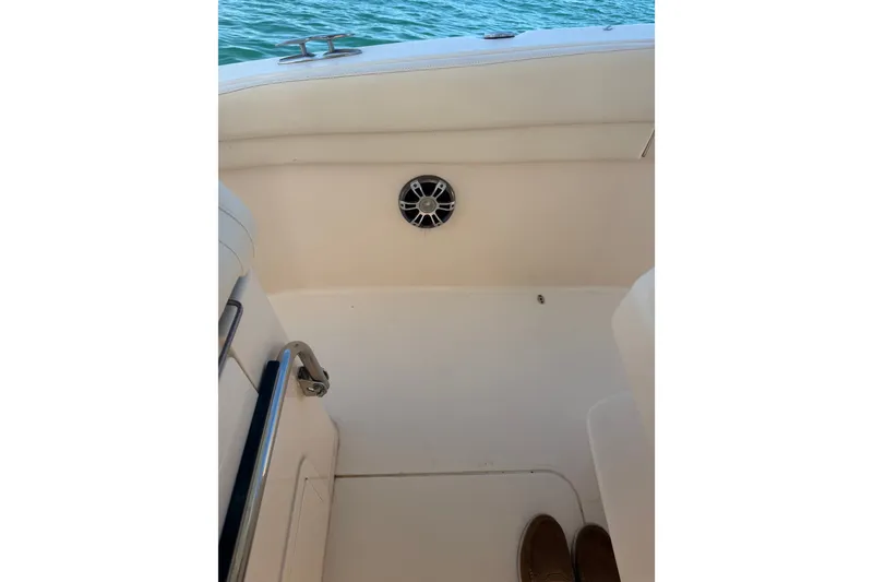 Slide: The Image of Interior view of 2021 Grady-White Canyon 326 boat, featuring seating and speaker. - 67