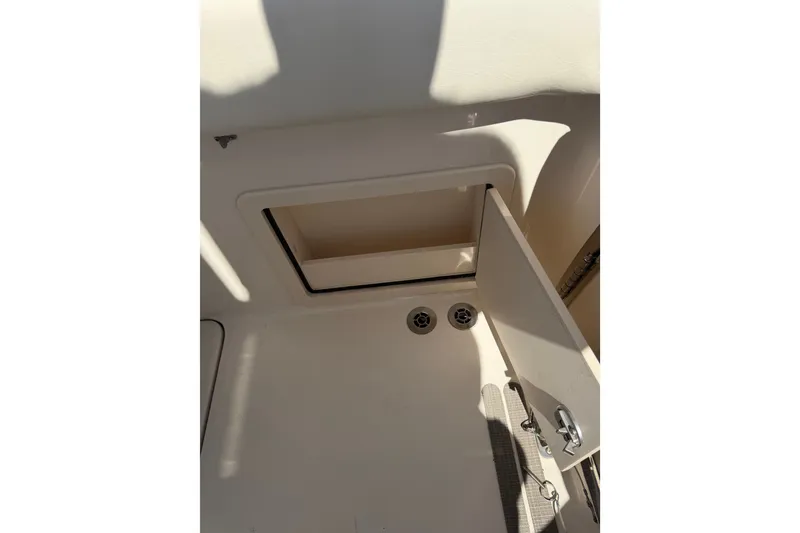 Slide: The Image of Open storage compartment on 2021 Grady-White Canyon 326 boat. - 99