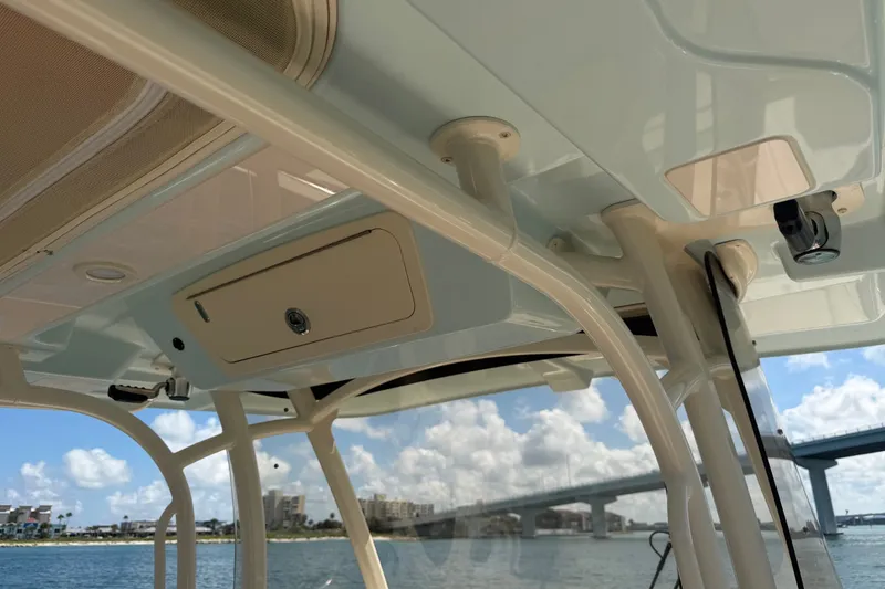 Slide: The Image of 2021 Grady-White Canyon 326 boat interior, showcasing overhead storage and support structures. - 71