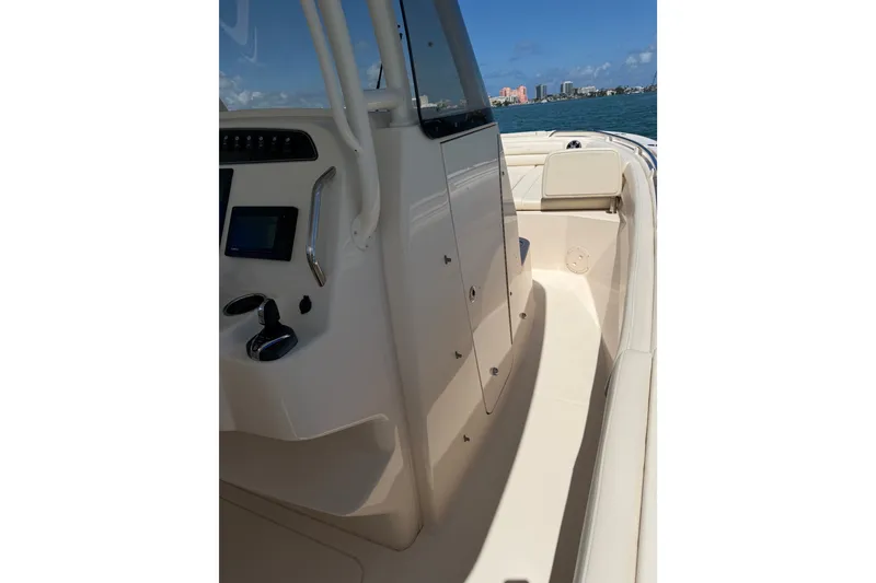 Slide: The Image of 2021 Grady-White Canyon 326 boat interior with control panel and seating. - 107