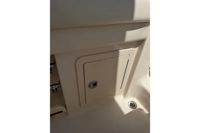 Slide: The Image of Storage compartment on a 2021 Grady-White Canyon 326 boat interior. - 101