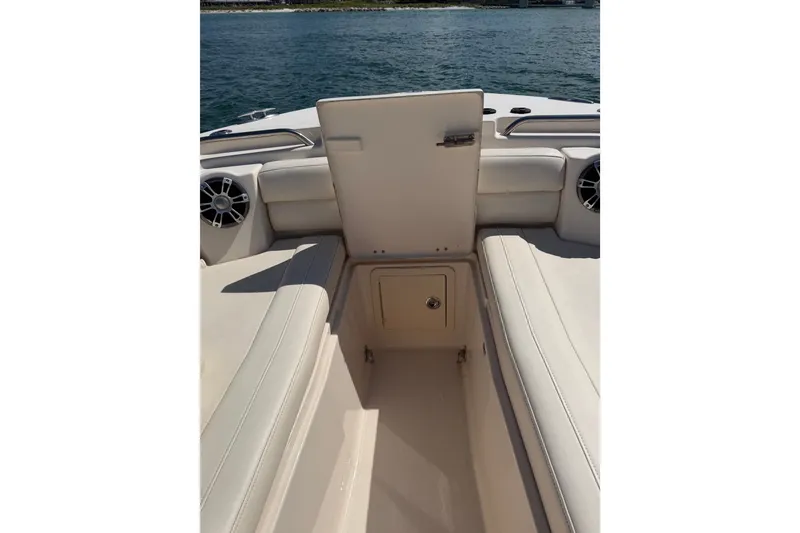 Slide: The Image of 2021 Grady-White Canyon 326 boat interior with open storage compartment. - 46