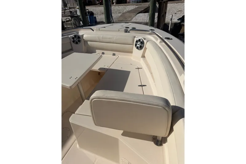 Slide: The Image of 2021 Grady-White Canyon 326 boat interior with seating and table. - 60