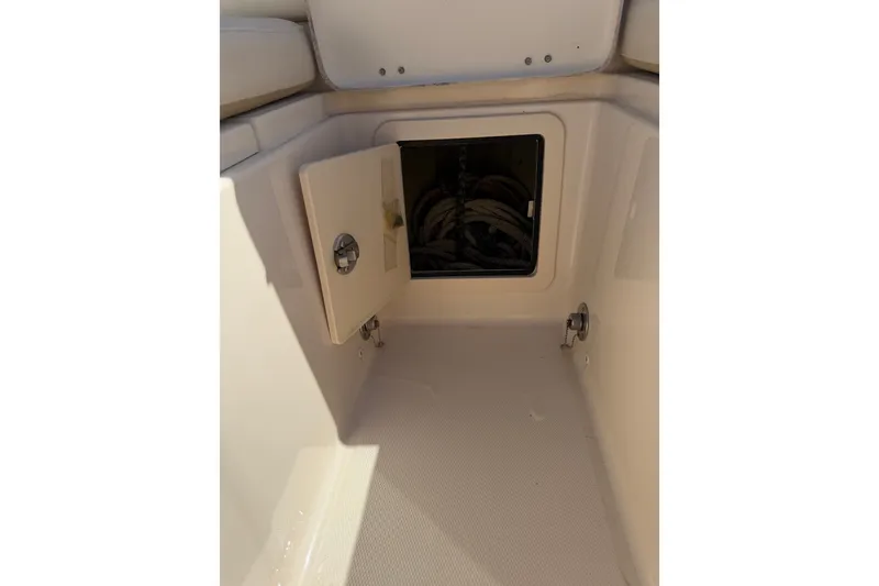 Slide: The Image of Open storage compartment on 2021 Grady-White Canyon 326 boat interior. - 43