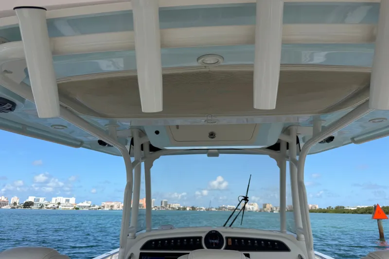 Slide: The Image of 2021 Grady-White Canyon 326 boat interior with ocean and city skyline view. - 114