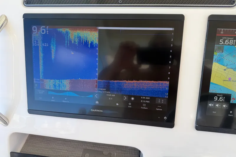 Slide: The Image of Garmin marine display on 2021 Grady-White Canyon 326 showing sonar and navigation data. - 56