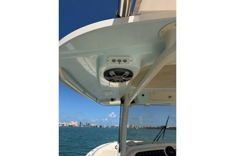 Slide: The Image of 2021 Grady-White Canyon 326 boat with speaker system, ocean view background. - 108