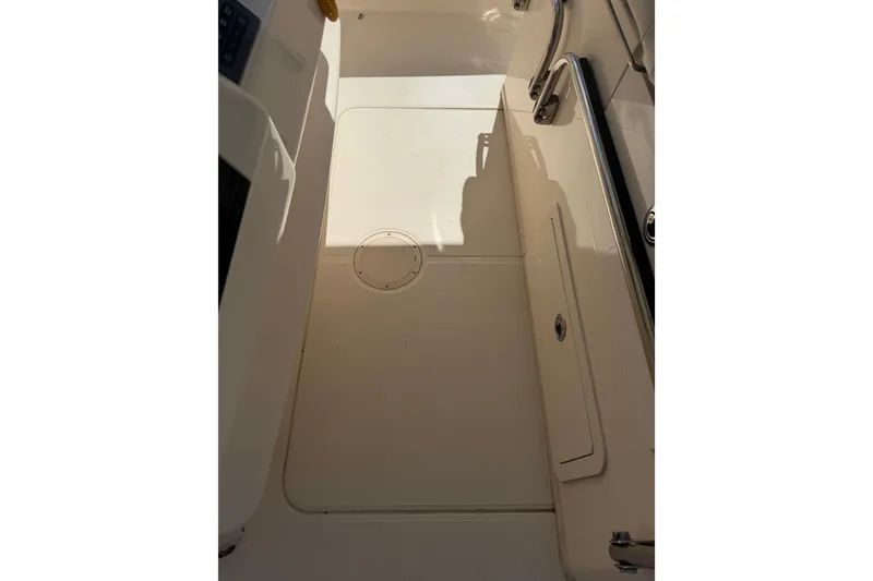 Slide: The Image of 2021 Grady-White Canyon 326 boat deck with storage compartments and clean design. - 116
