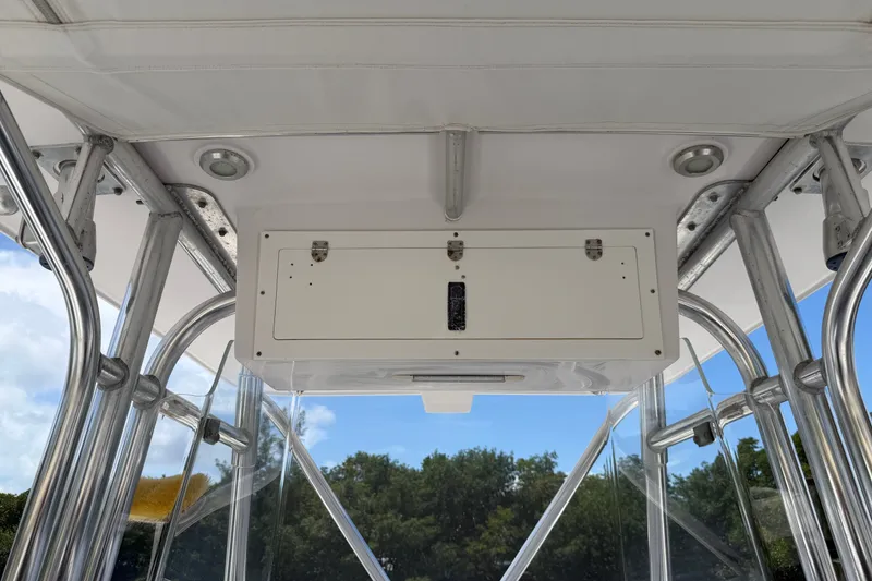 Slide: The Image of 2013 Fountain 34 Center Console boat interior with overhead storage and metal framework. - 21