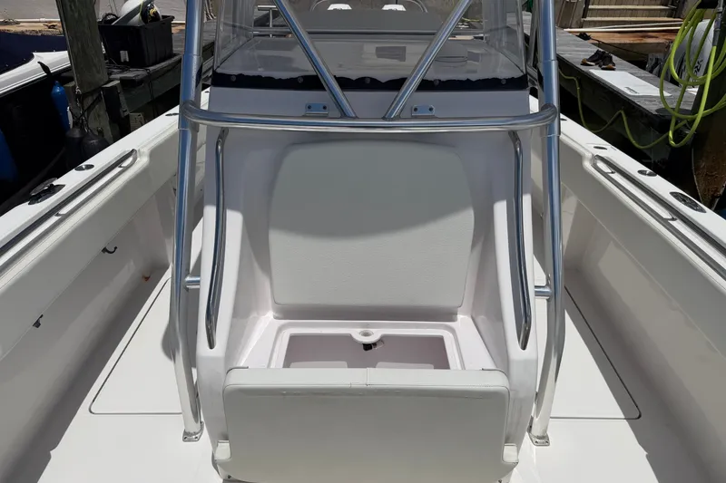 Slide: The Image of 2013 Fountain 34 Center Console boat interior with seating and stainless steel railings. - 37