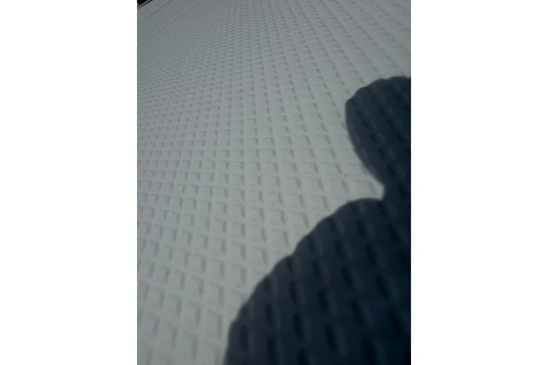 Slide: The Image of Textured surface of a 2013 Fountain 34 Center Console boat deck. - 32