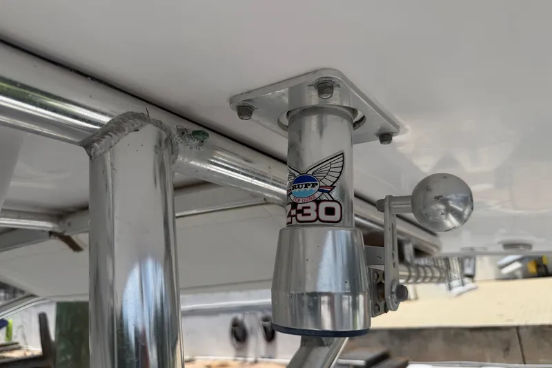 Slide: The Image of Close-up of Rupp Top Gun Z-30 outrigger mount on 2013 Fountain 34 Center Console boat. - 39