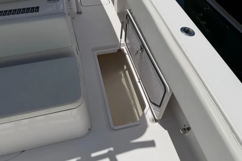 Slide: The Image of 2013 Fountain 34 Center Console boat interior with open storage compartment. - 44