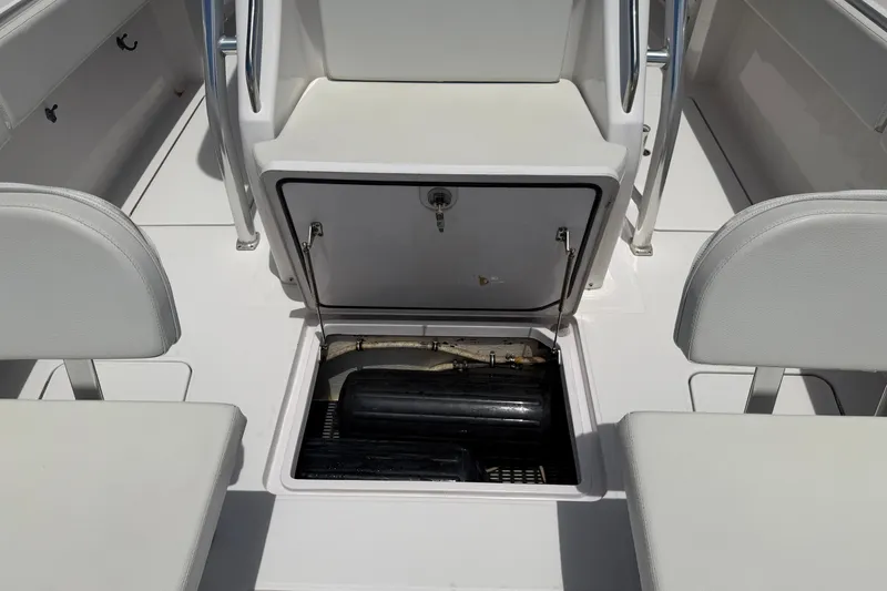 Slide: The Image of 2013 Fountain 34 Center Console boat interior with open storage compartment. - 34