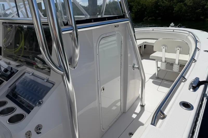 Slide: The Image of 2013 Fountain 34 Center Console boat interior with seating and control panel. - 20