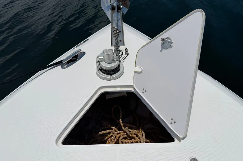 Slide: The Image of Open anchor locker on 2013 Fountain 34 Center Console boat with ropes inside. - 33