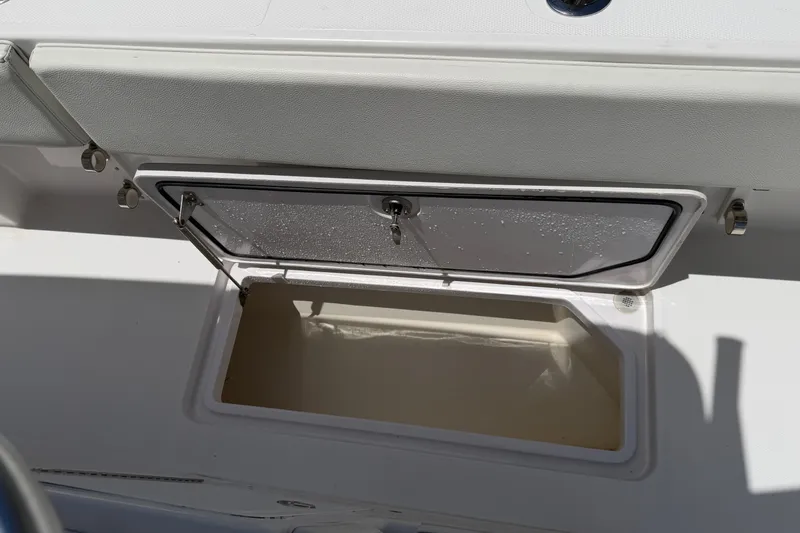 Slide: The Image of Open storage compartment on 2013 Fountain 34 Center Console boat. - 45