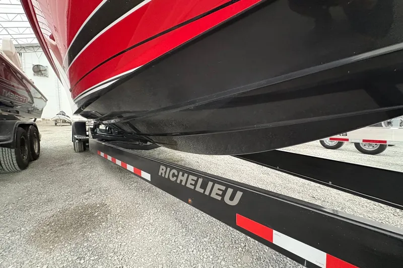 Slide: The Image of Red and black 2025 Statement 350 Open boat on Richelieu trailer. - 11