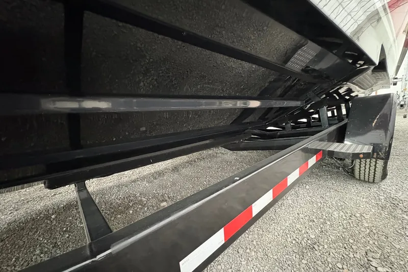 Slide: The Image of Underneath view of a 2025 Statement 350 Open boat on a trailer. - 13