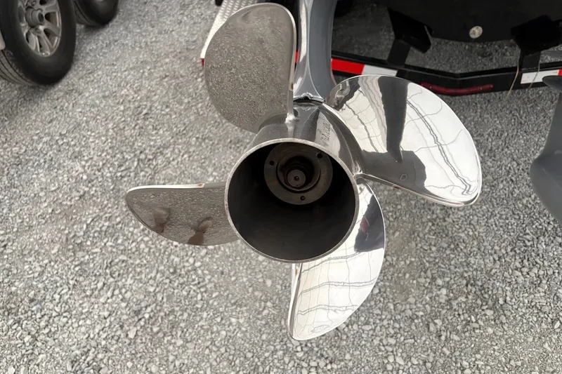 Slide: The Image of Shiny metal boat propeller on gravel, Statement 350 Open 2025 model. - 12
