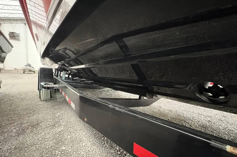 Slide: The Image of 2025 Statement 350 Open boat on trailer, showcasing hull design and structure. - 14