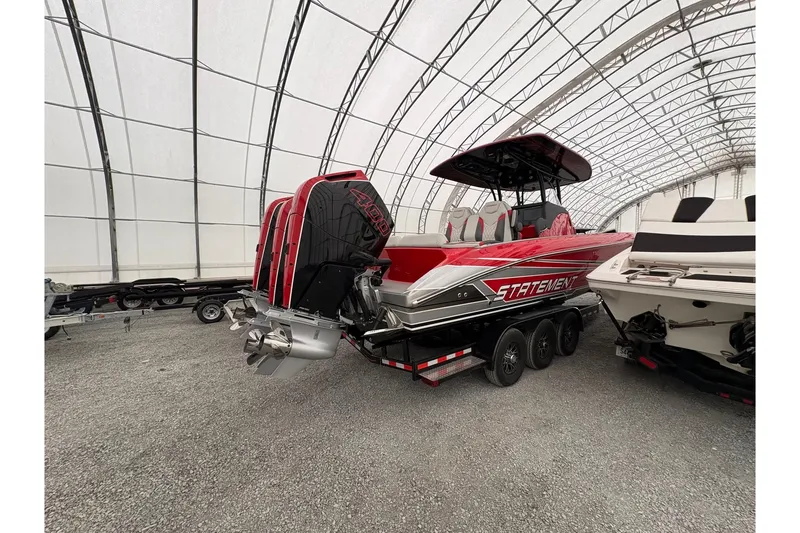 Slide: The Image of 2025 Statement 350 Open boat in storage, featuring vibrant red and black design. - 4