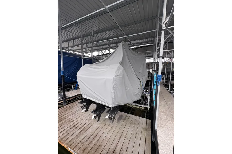 Slide: The Image of Covered 2017 Statement 380 Open boat on dock under shelter. - 34