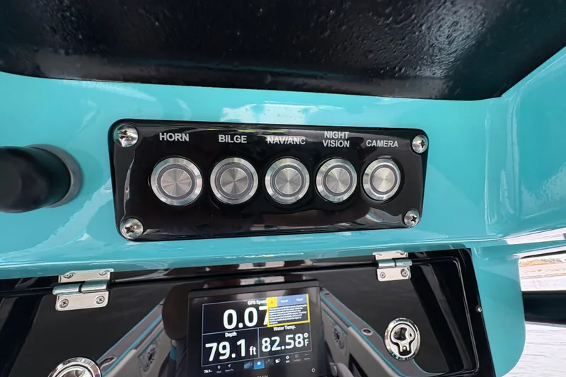 Slide: The Image of Control panel of a 2017 Statement 380 Open boat with various function buttons. - 25